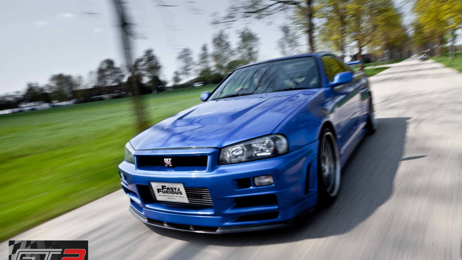 Paul Walker Speeding Down The Highway In A Fast And Furious Nissan Skyline. Background
