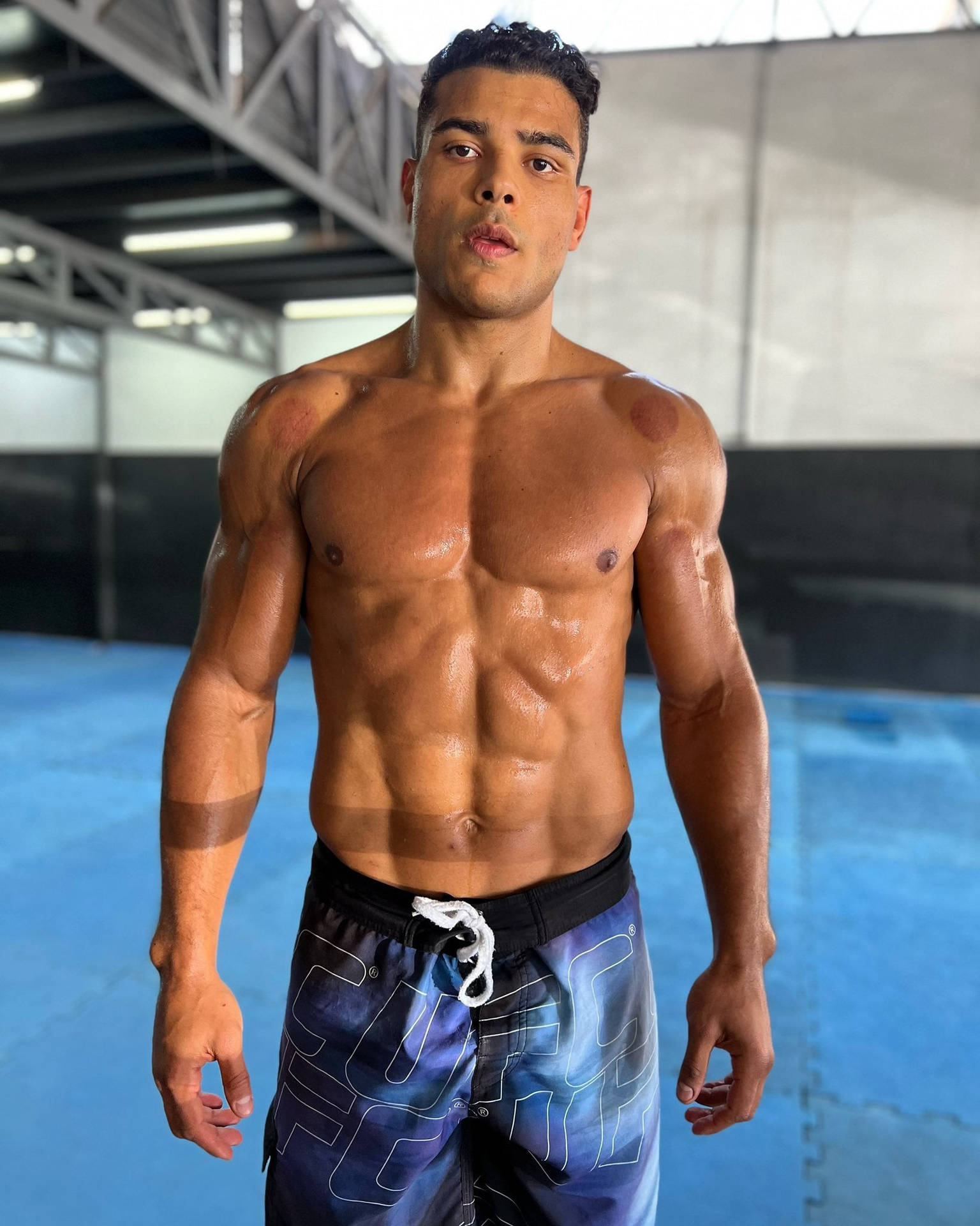 Paulo Costa Showing Abs