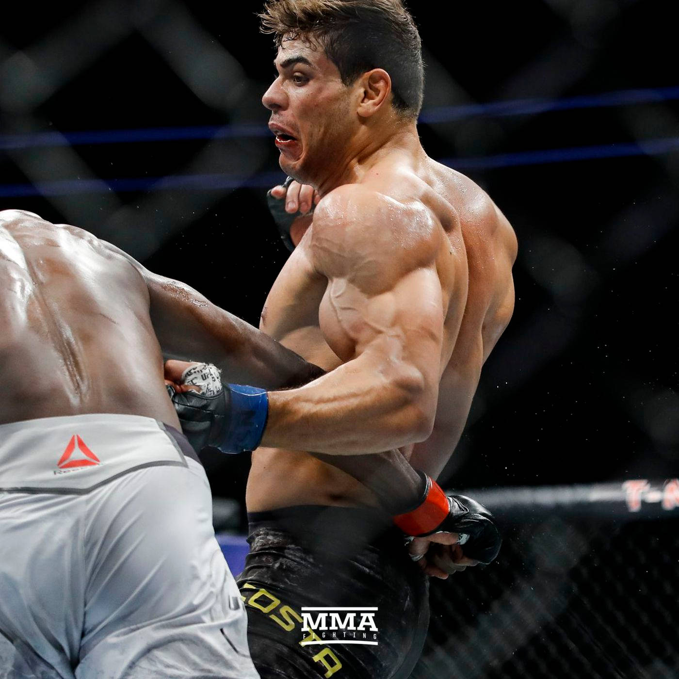 Paulo Costa Skillfully Avoiding Punch Background