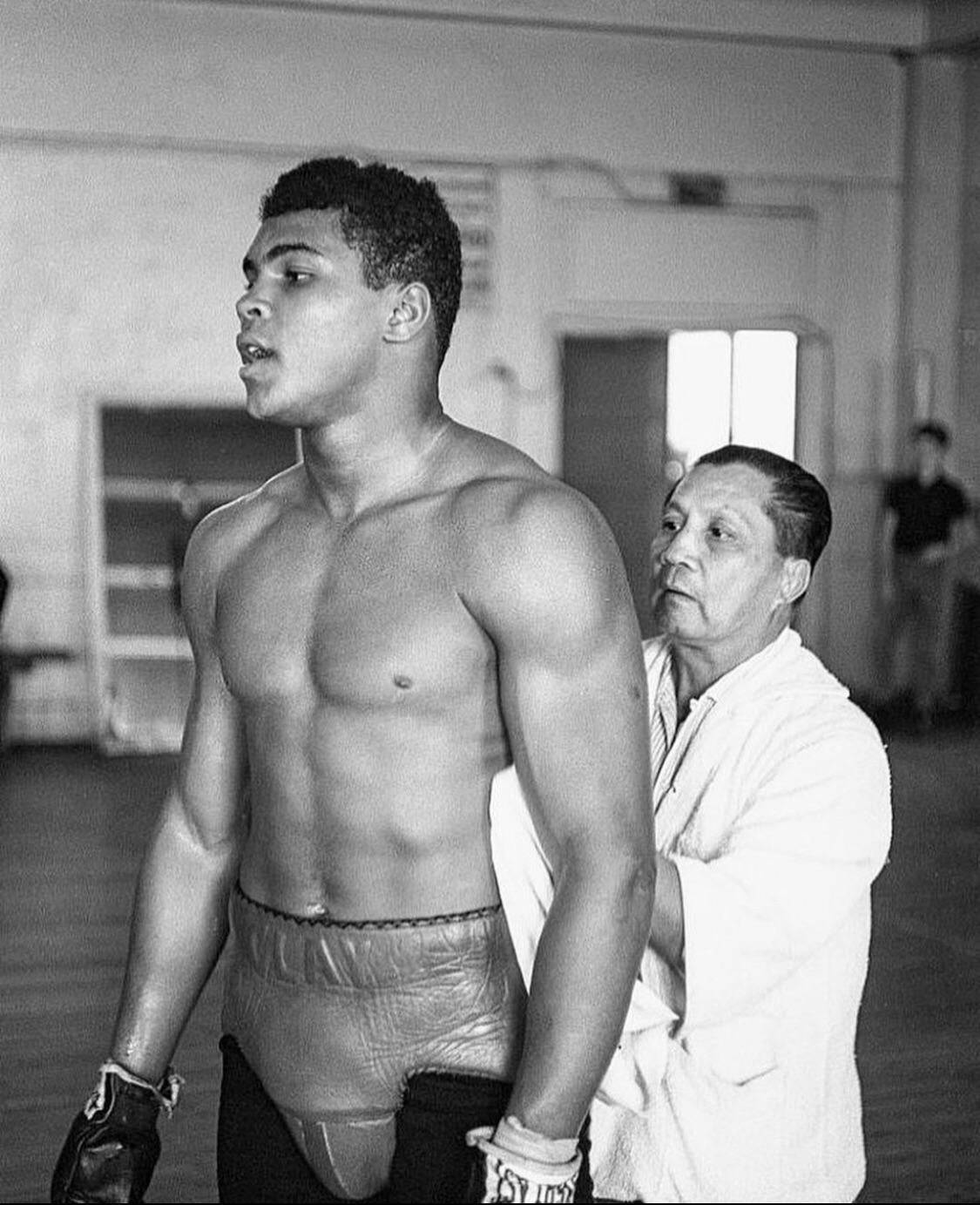 Paulo Costa With Trainer Background