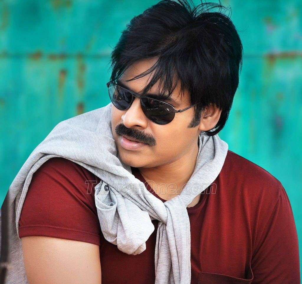 Pawan Kalyan Captivating The Audience In Red Outfit Background