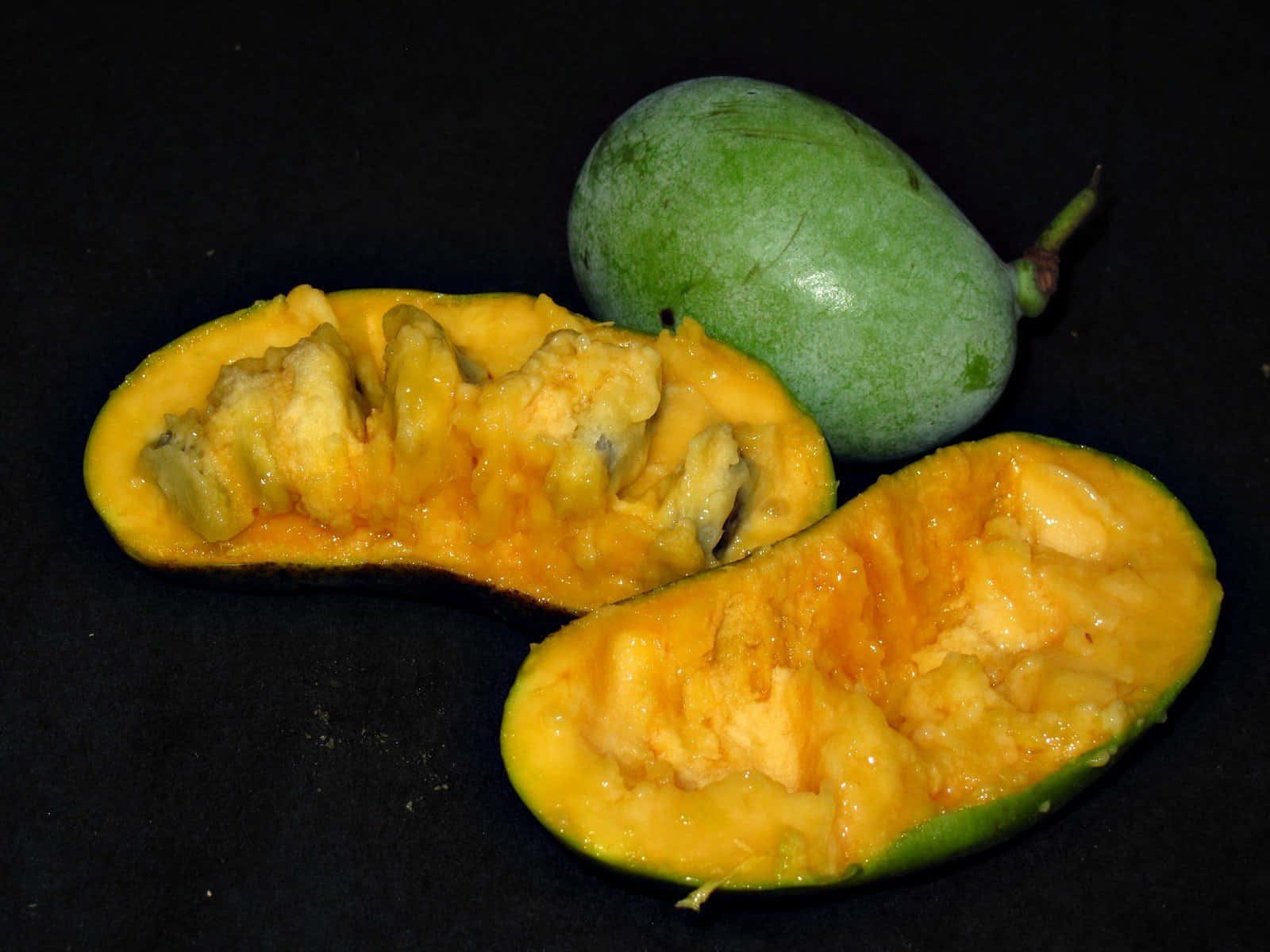 Pawpaw Fruit Halvedand Whole Background