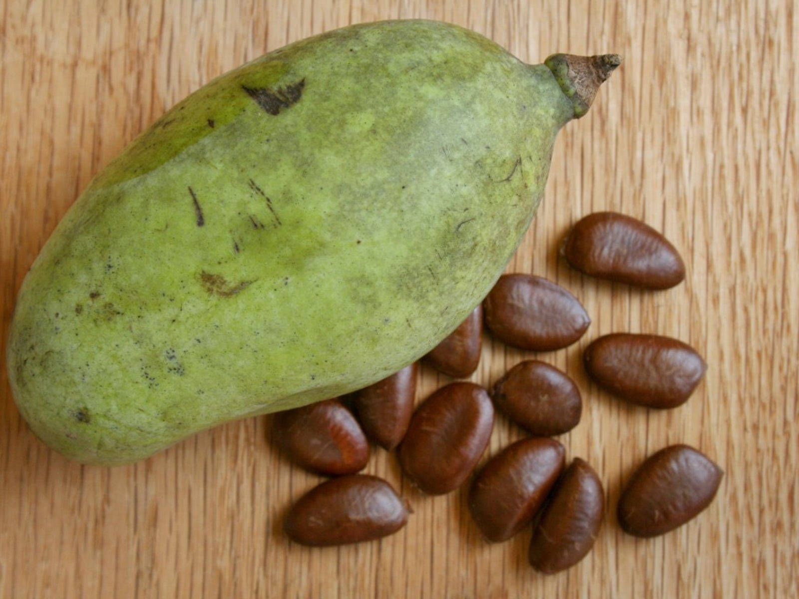 Pawpaw Fruit With Its Dry Seeds Background