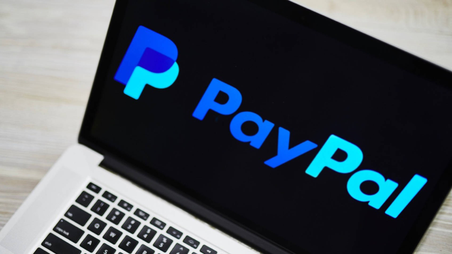 Paypal Logo At Laptop Screen Background
