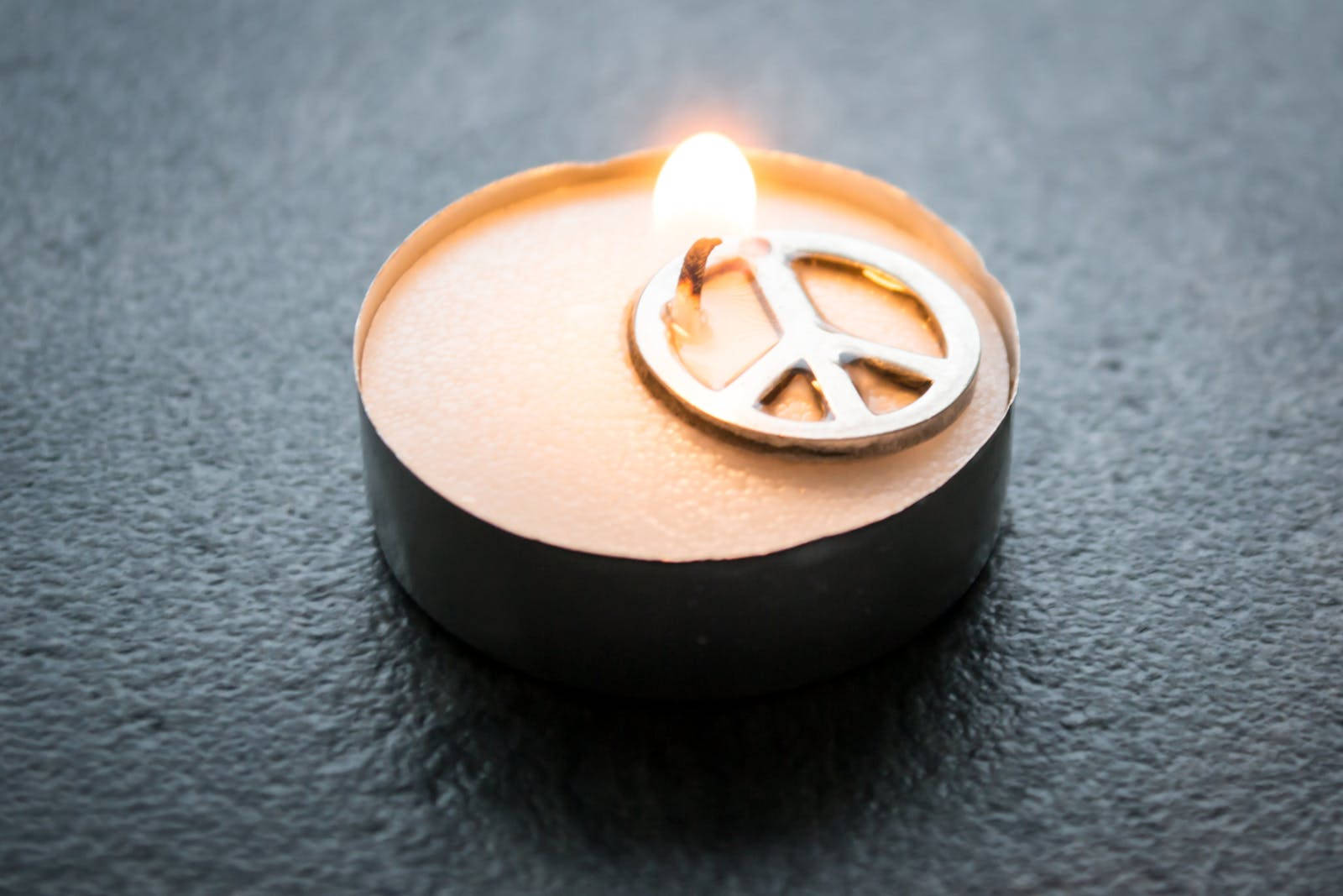 Peace Symbol On A Candle Background