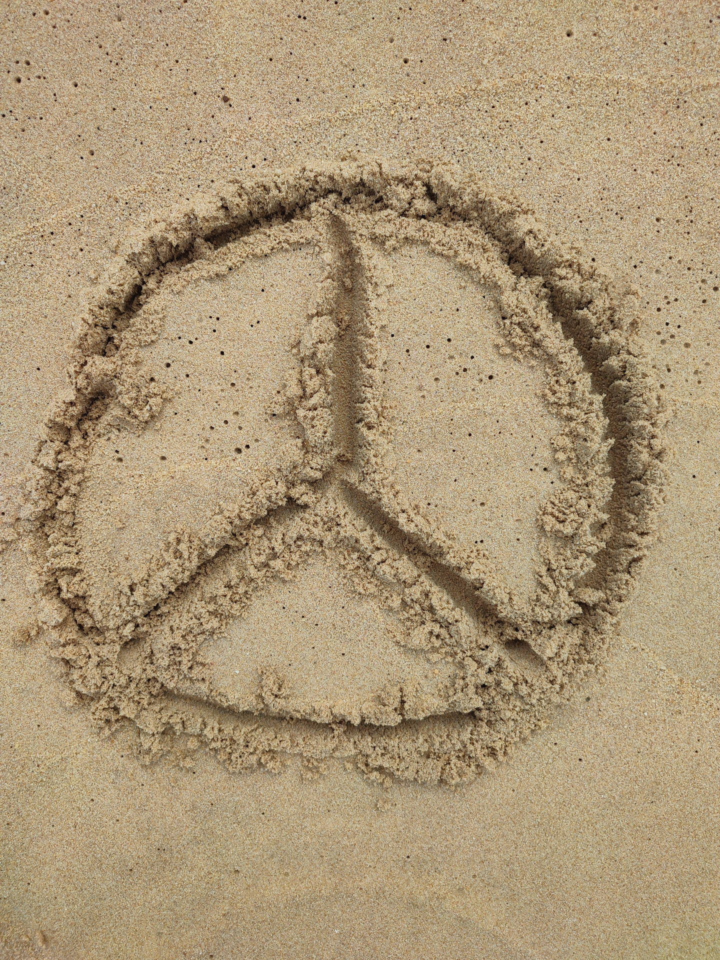 Peace Symbol Sand Drawing