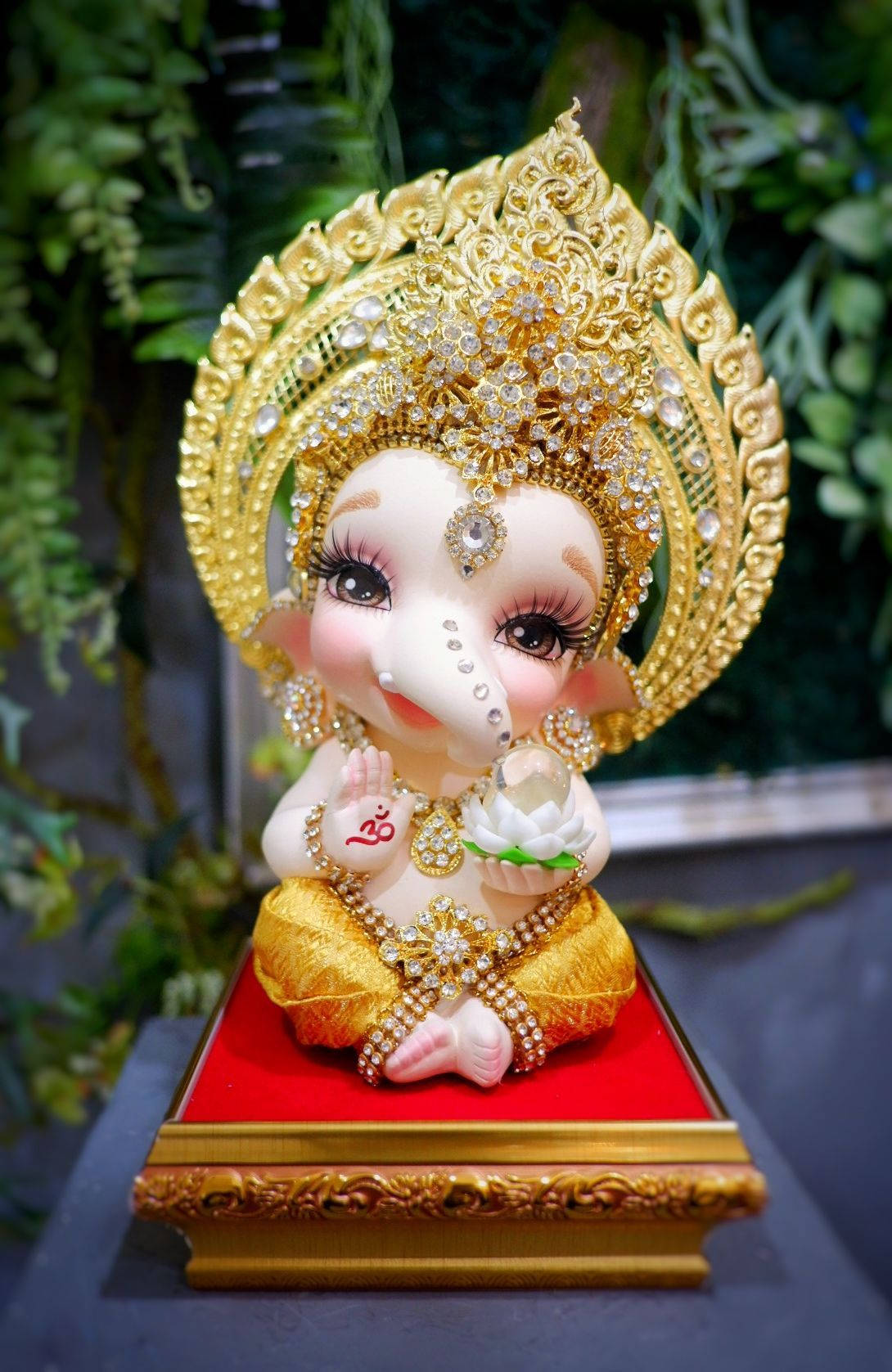 Peaceful Baby Ganesh Blessing With White Lotus
