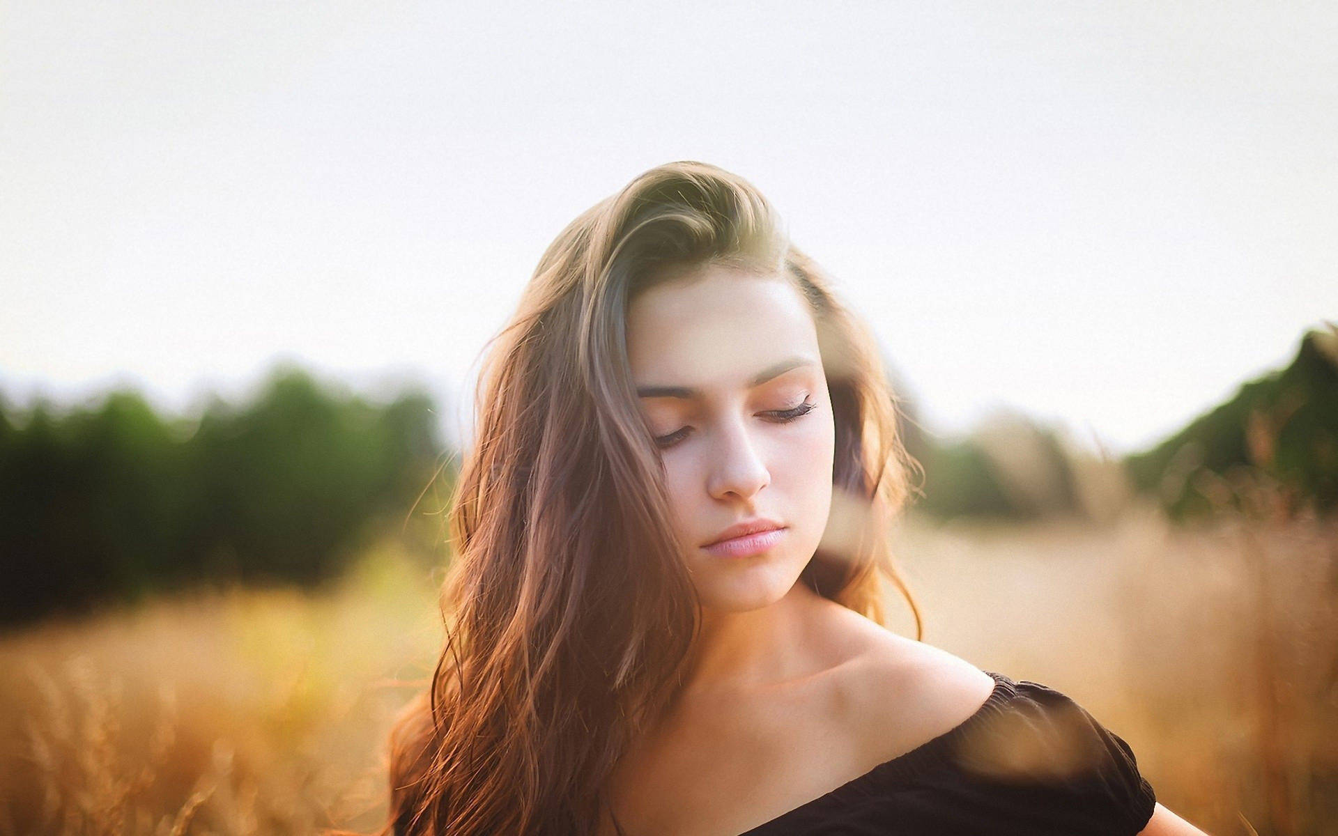 Peaceful Mature Woman Enjoying Nature Near Tall Grass Background