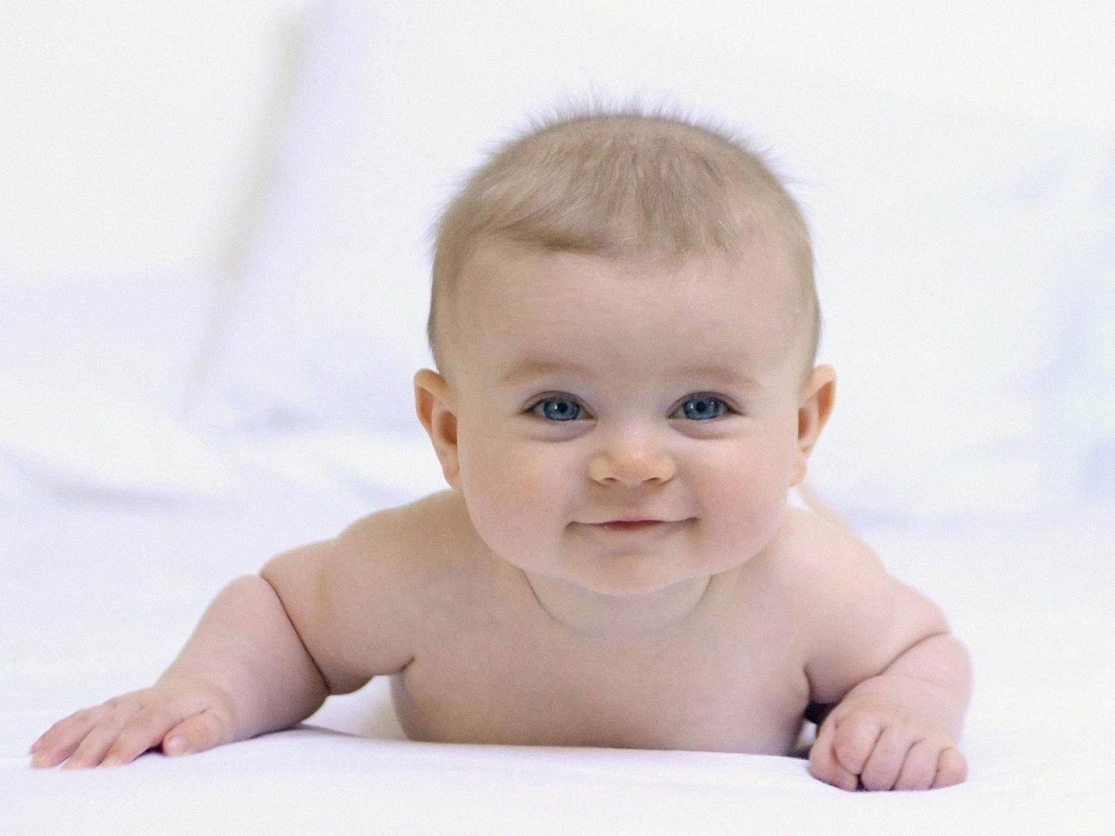 Peaceful Newborn Baby Asleep On A Comfortable Bed Background