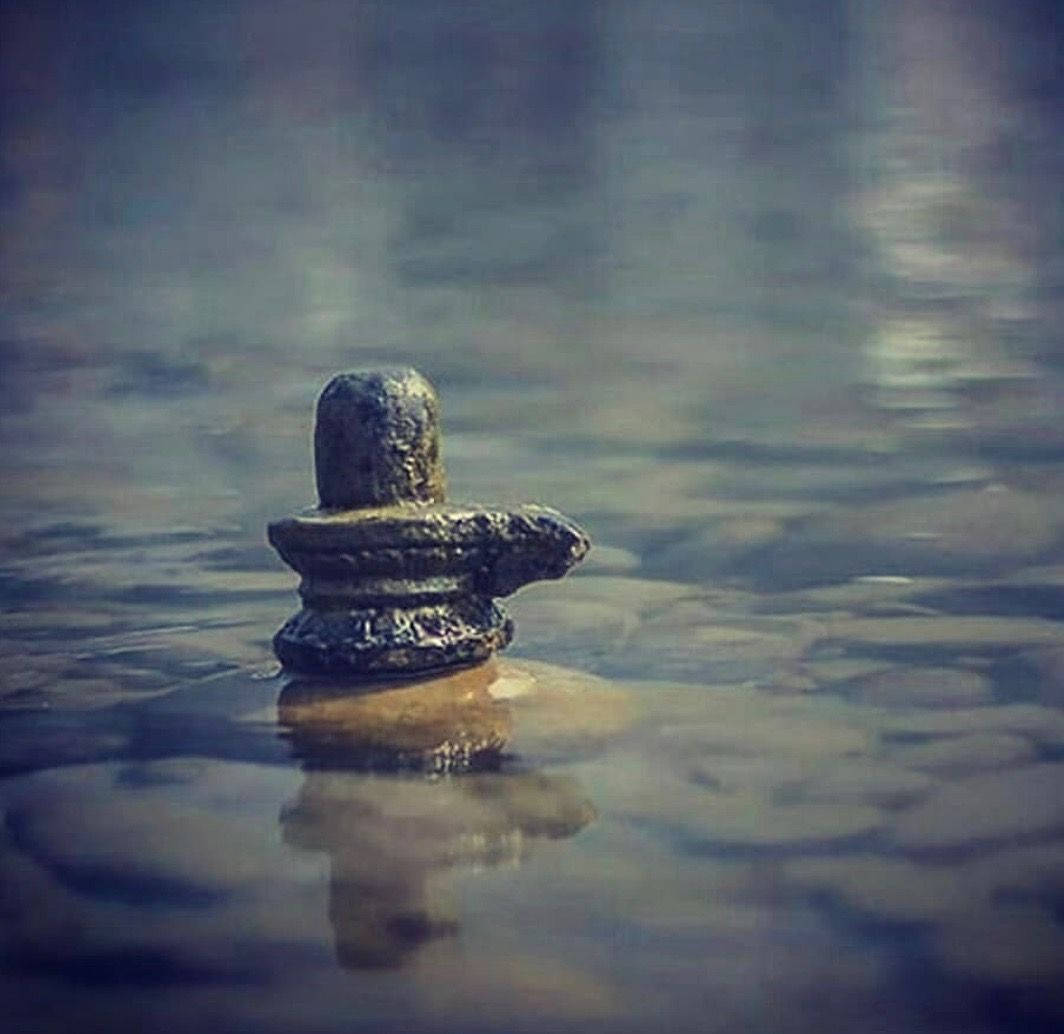 Peaceful Shallow Water Shiva Lingam Background