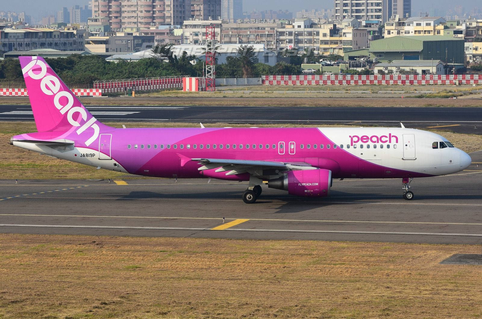 Peach Aviation Airplane On Runway Background