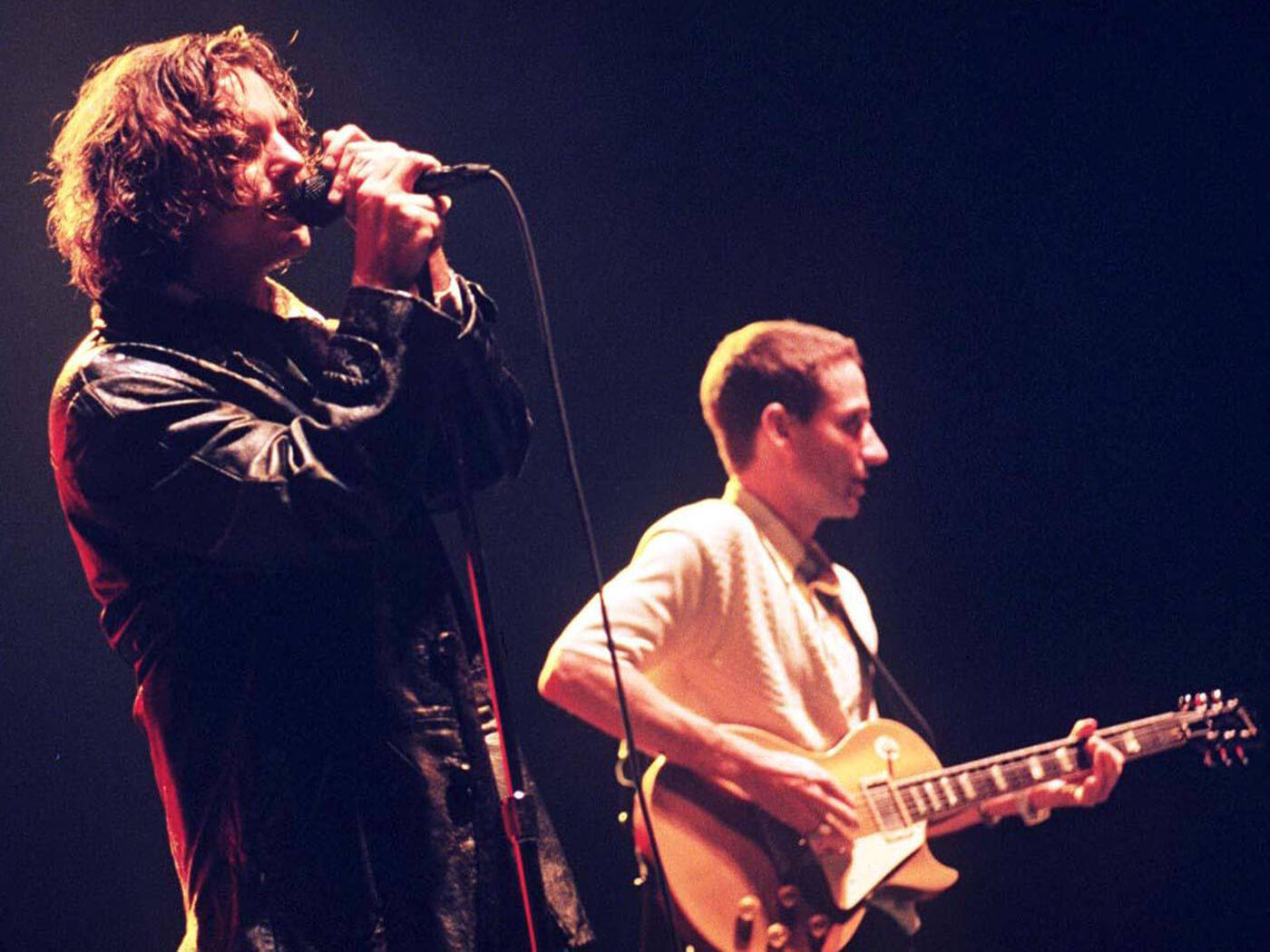 Pearl Jam Rock Band's Frontman Eddie Vedder Engrossed In Performance Background