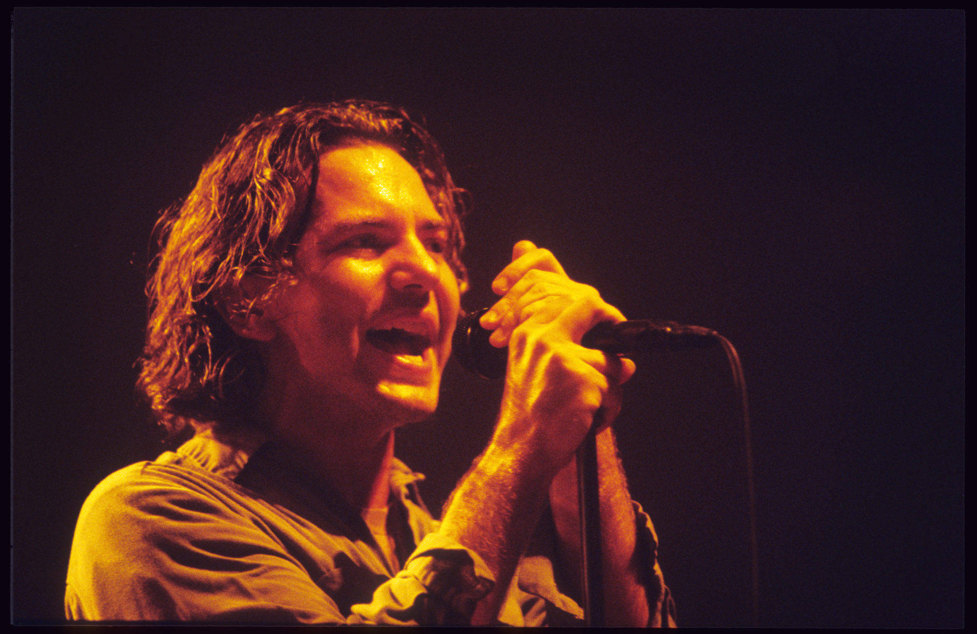 Pearl Jam Rocking The Stage With Eddie Vedder Background
