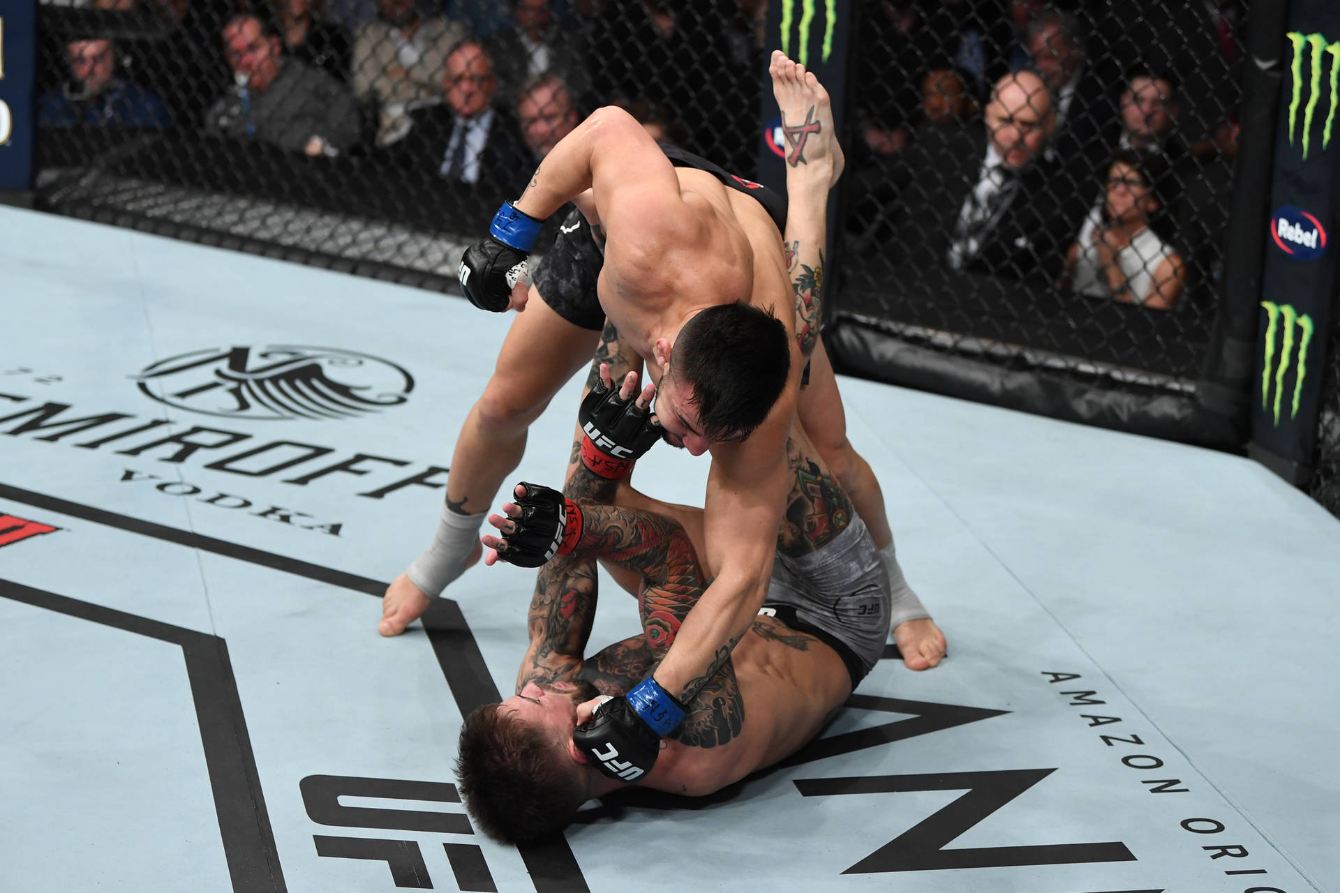 Pedro Munhoz In Action Executing A Powerful Punch During An Mma Fight. Background