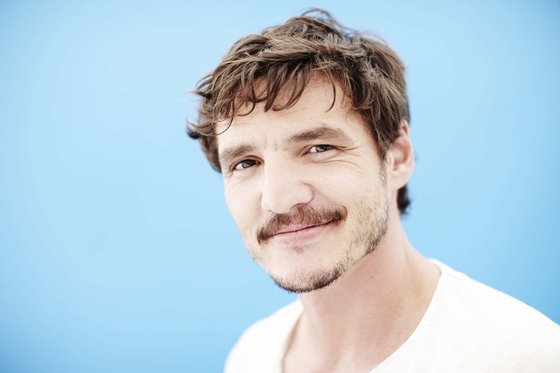 Pedro Pascal Smiling Portrait Background