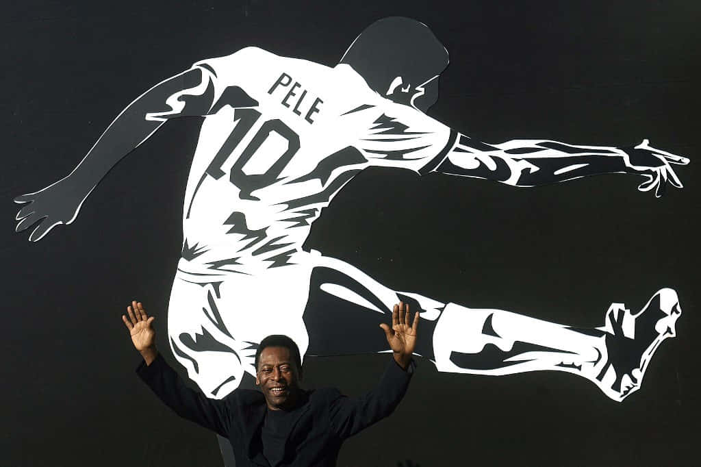 Pele Taking A Picture With His Impeccable Game Pose Background