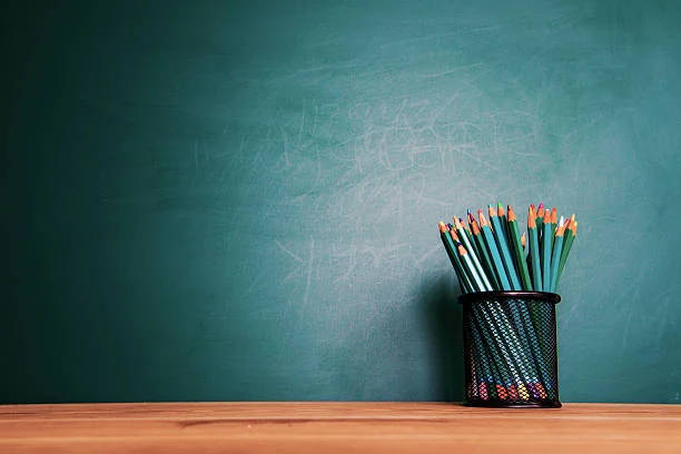 Pencils With Blackboard Education Background