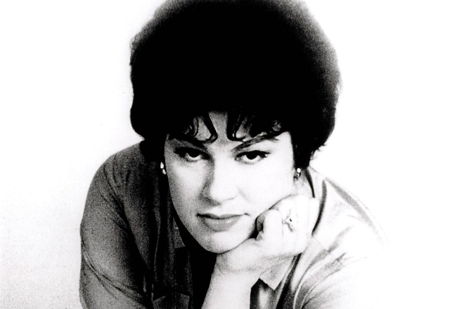 Pensive Patsy Cline Resting Her Face On Hand Background