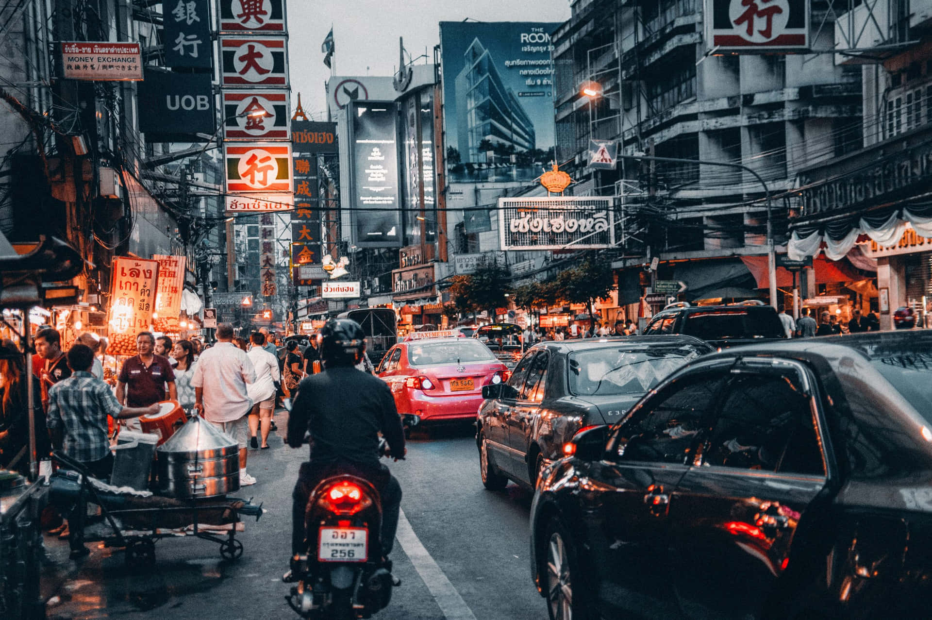 People And Cars Passing By Street Background