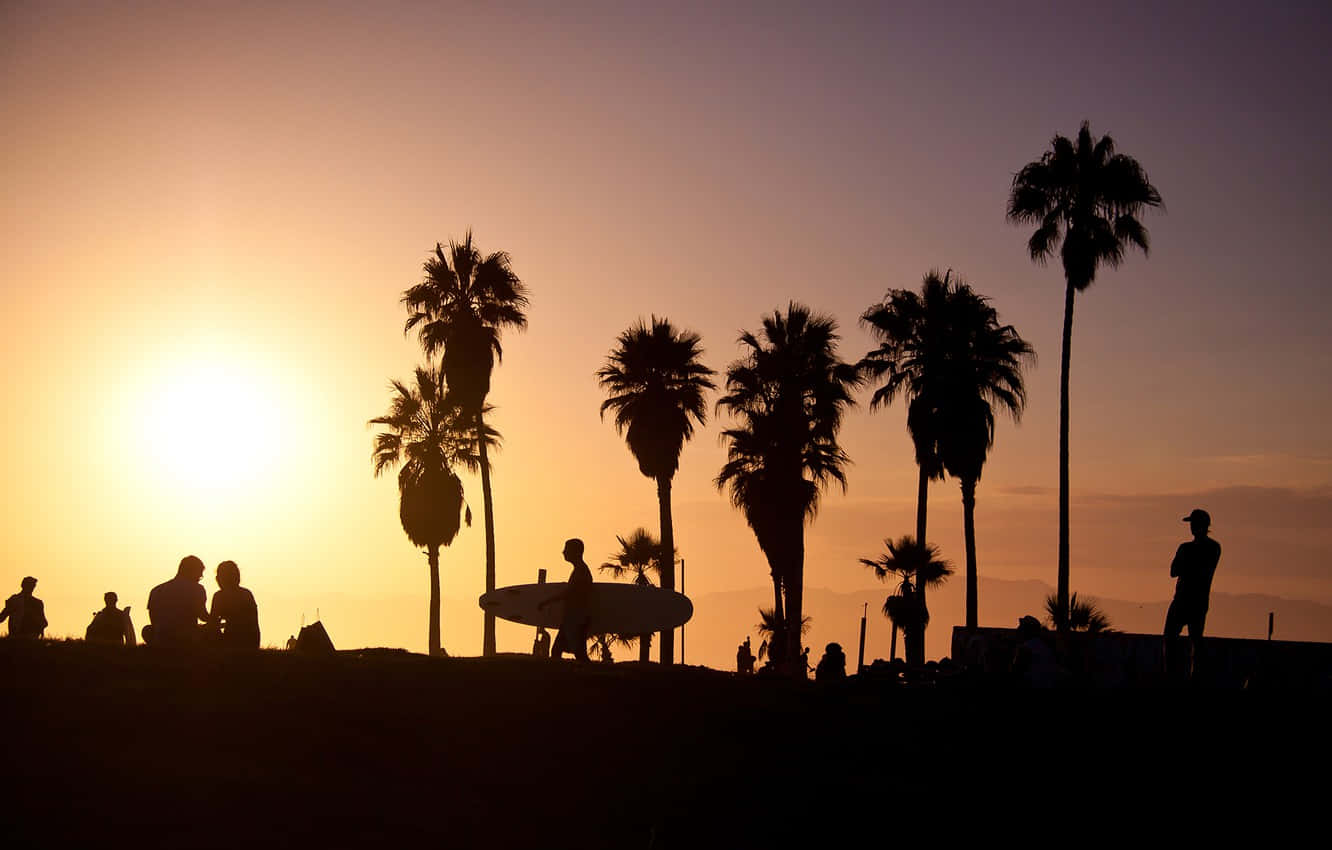 People Are Silhouetted At Sunset On A Hill Background