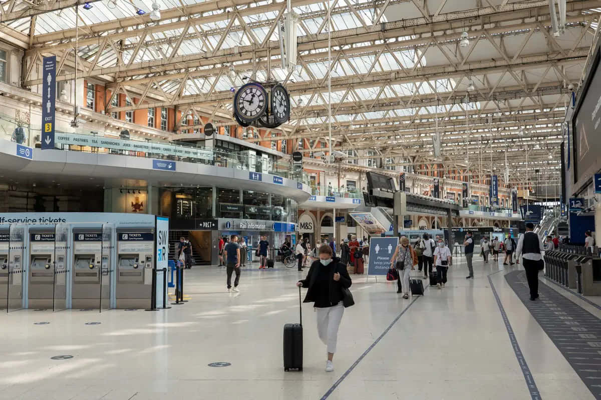People Arriving At Waterloo Station Background