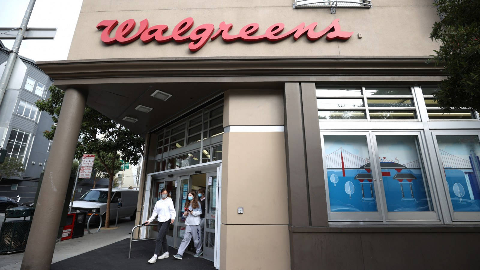 People Exiting Walgreens Store Background