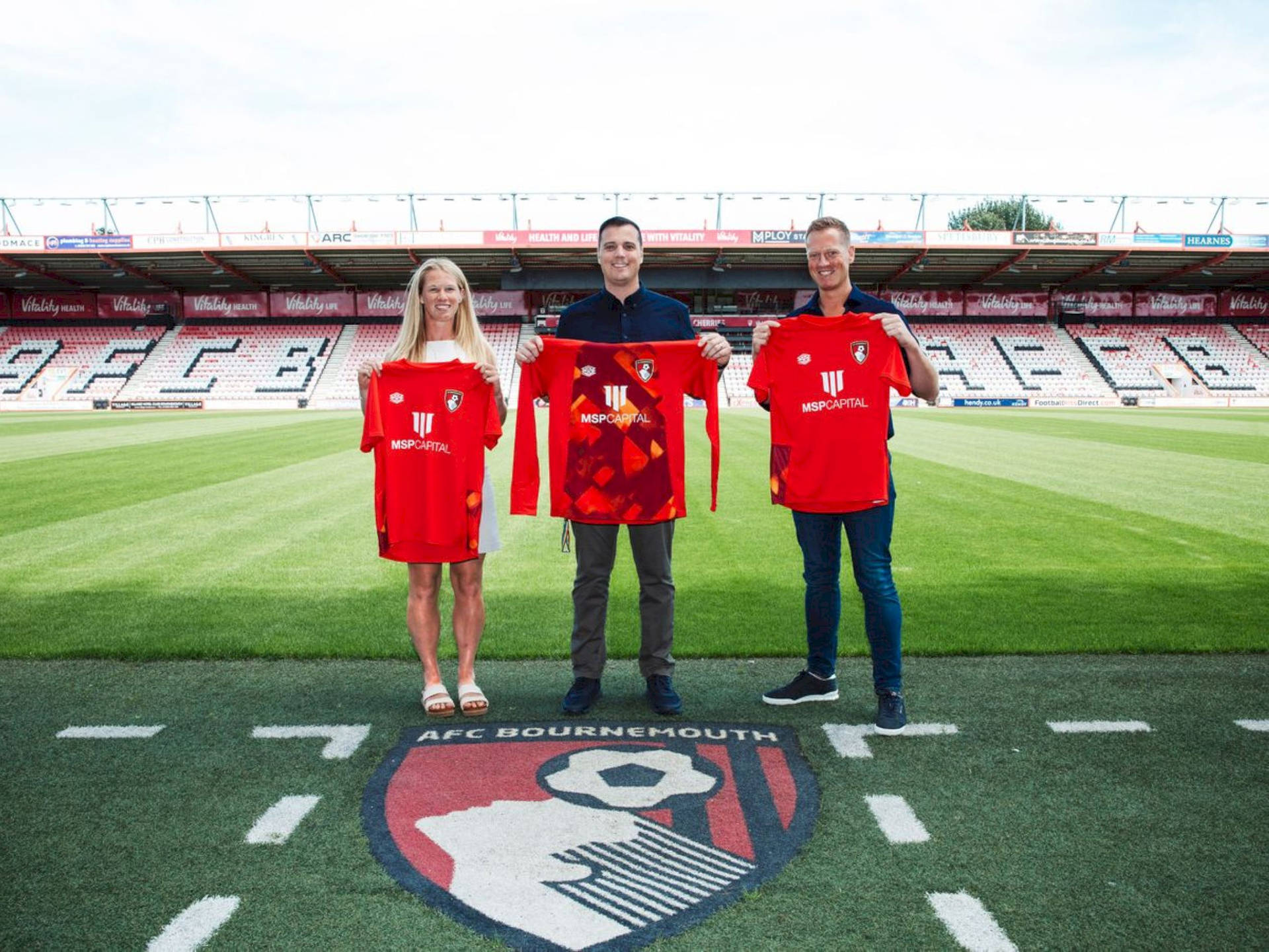 People Holding Afc Bournemouth Jerseys Background