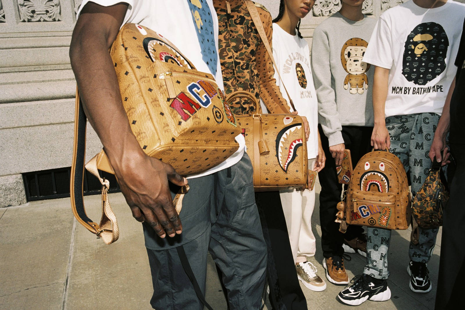 People Holding Mcm Backpacks