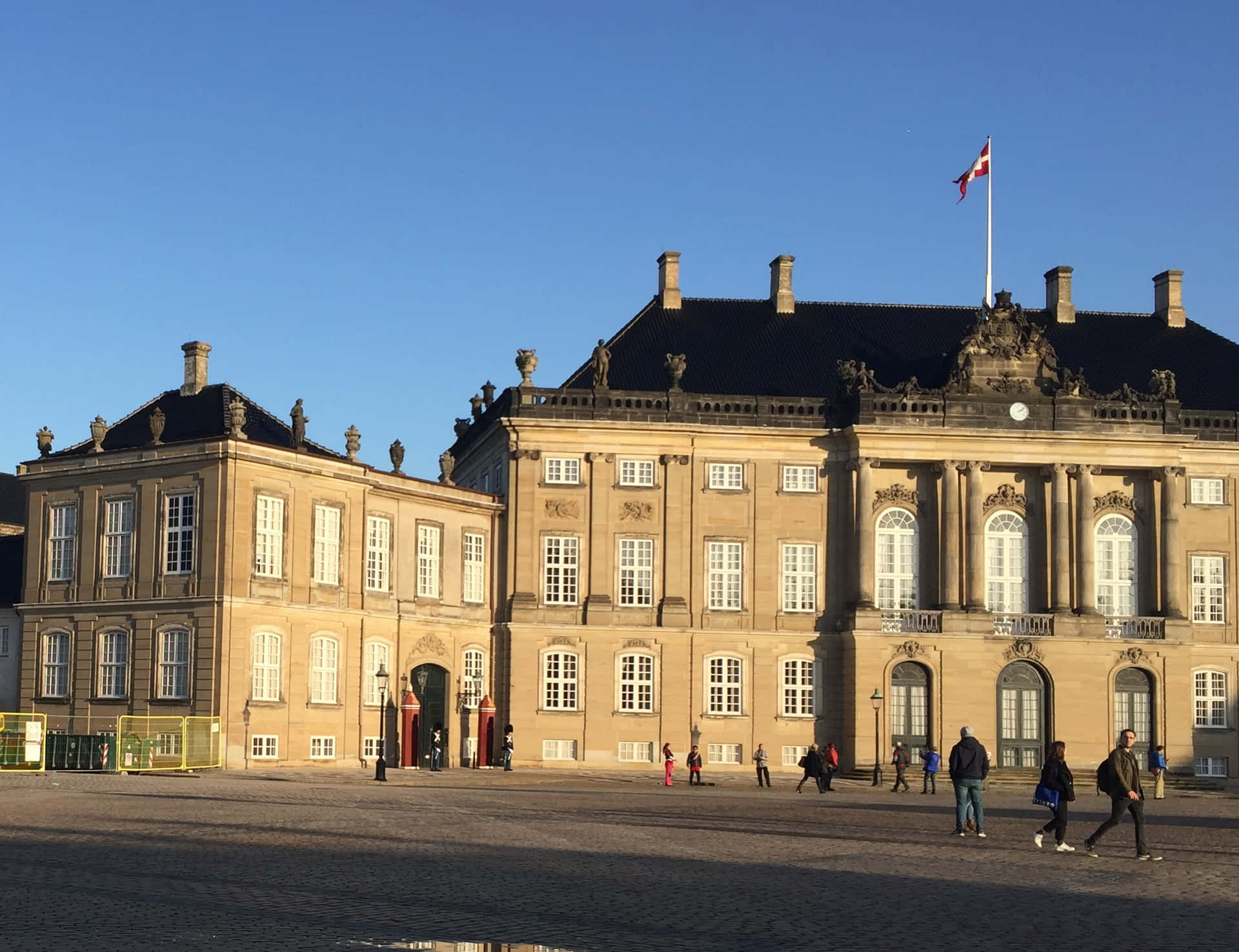 People In Amalienborg Palace Background