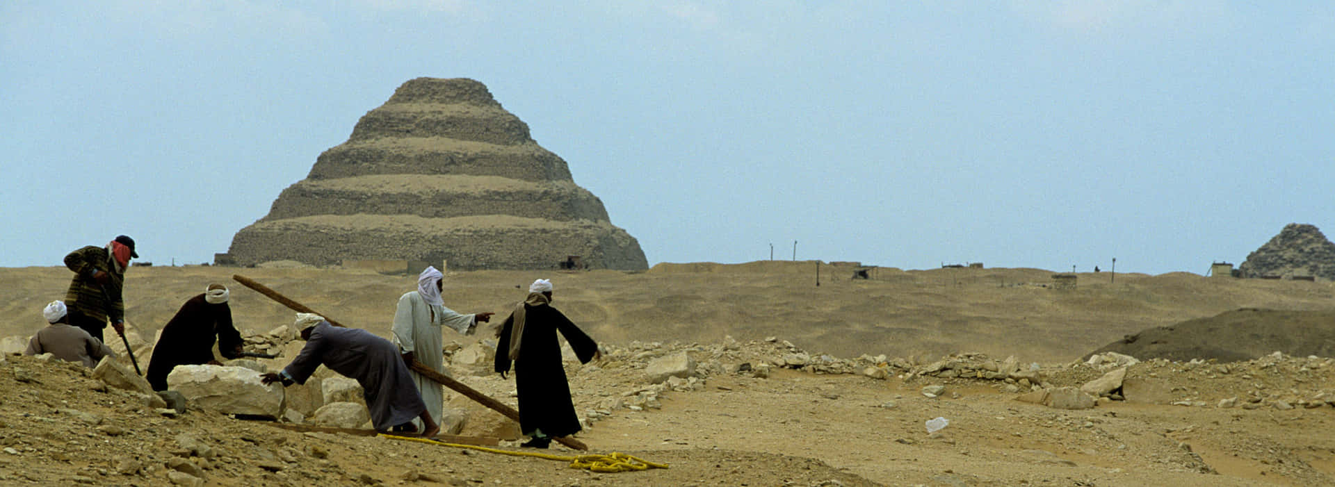 People In Saqqara Pyramid Background