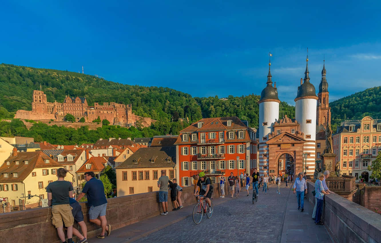 People On Heidelberg Castle Background
