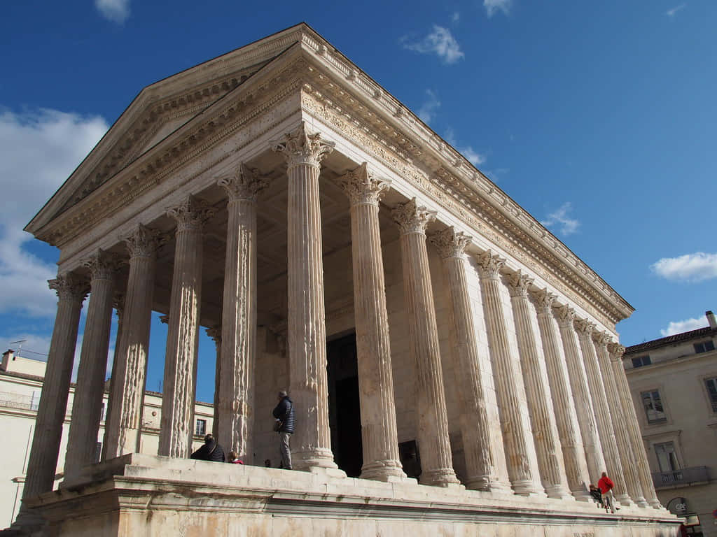 People On The Maison Carrée Background