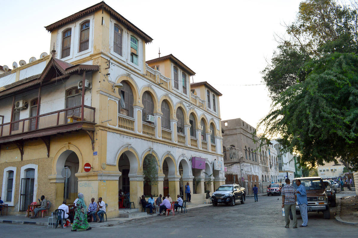 People Outside A Djibouti Building Background