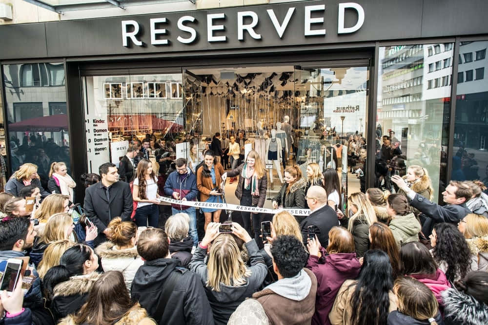 People Outside Reserved Clothing Shop Background