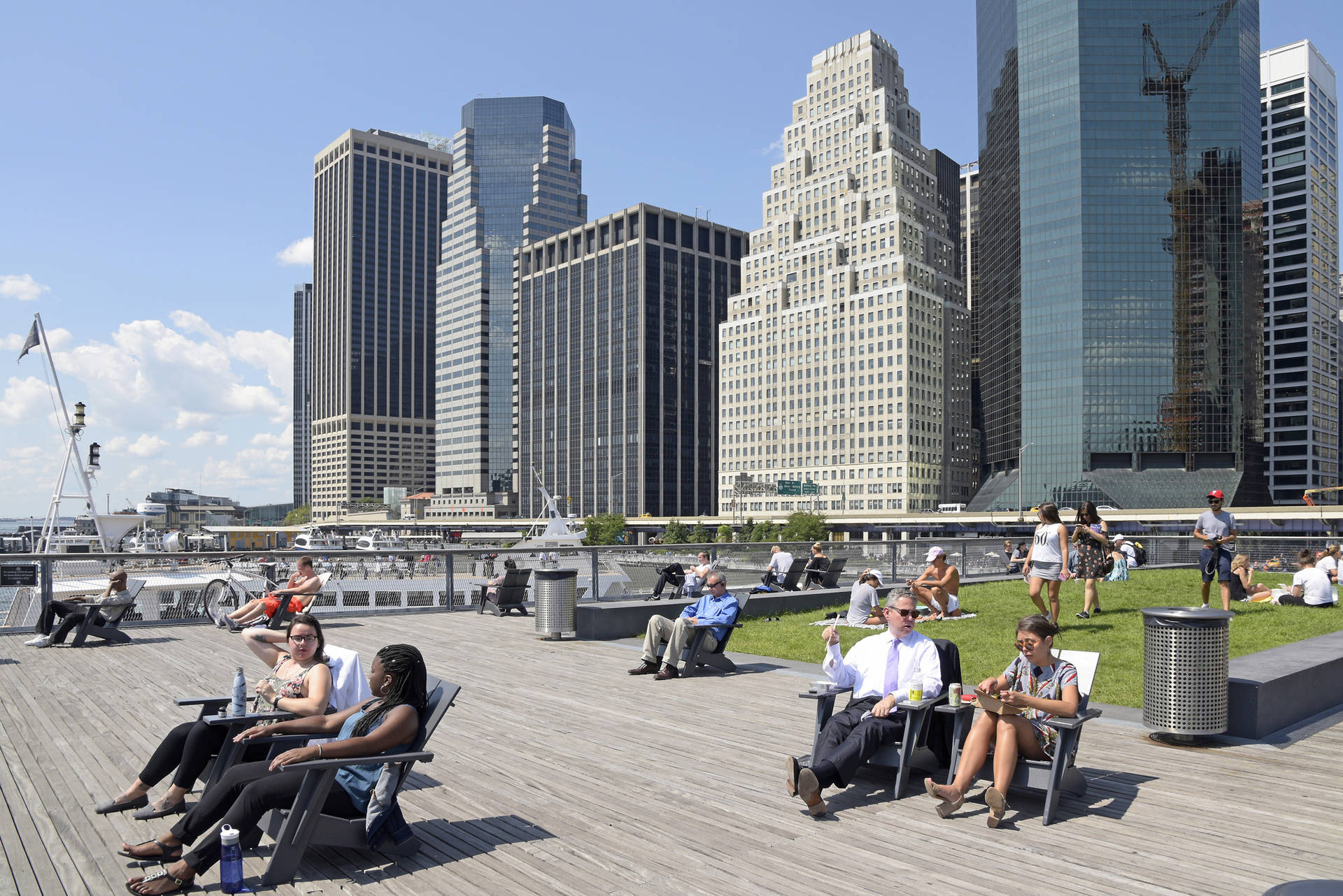 People Relaxing At South Street Seaport Background