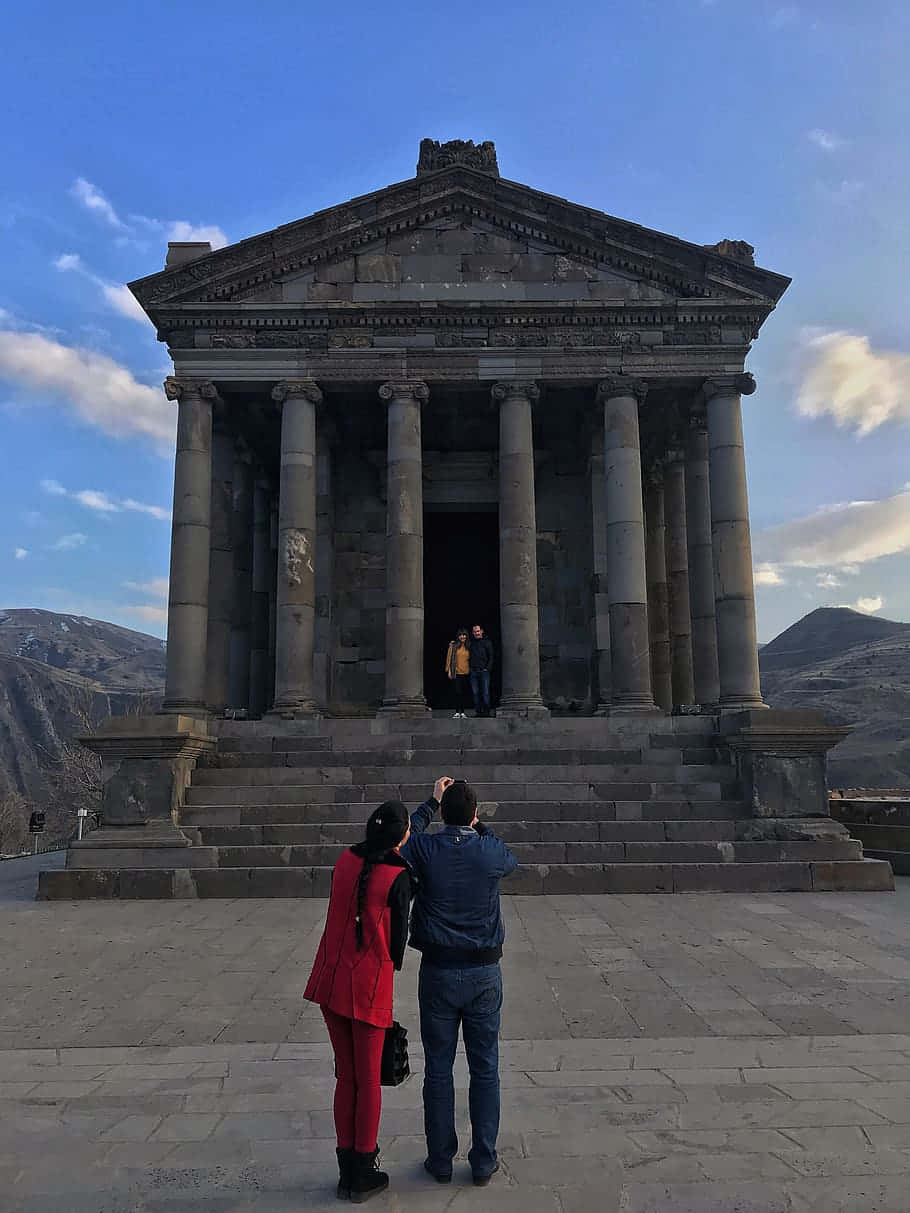 People Taking Pictures At Garni Temple Background