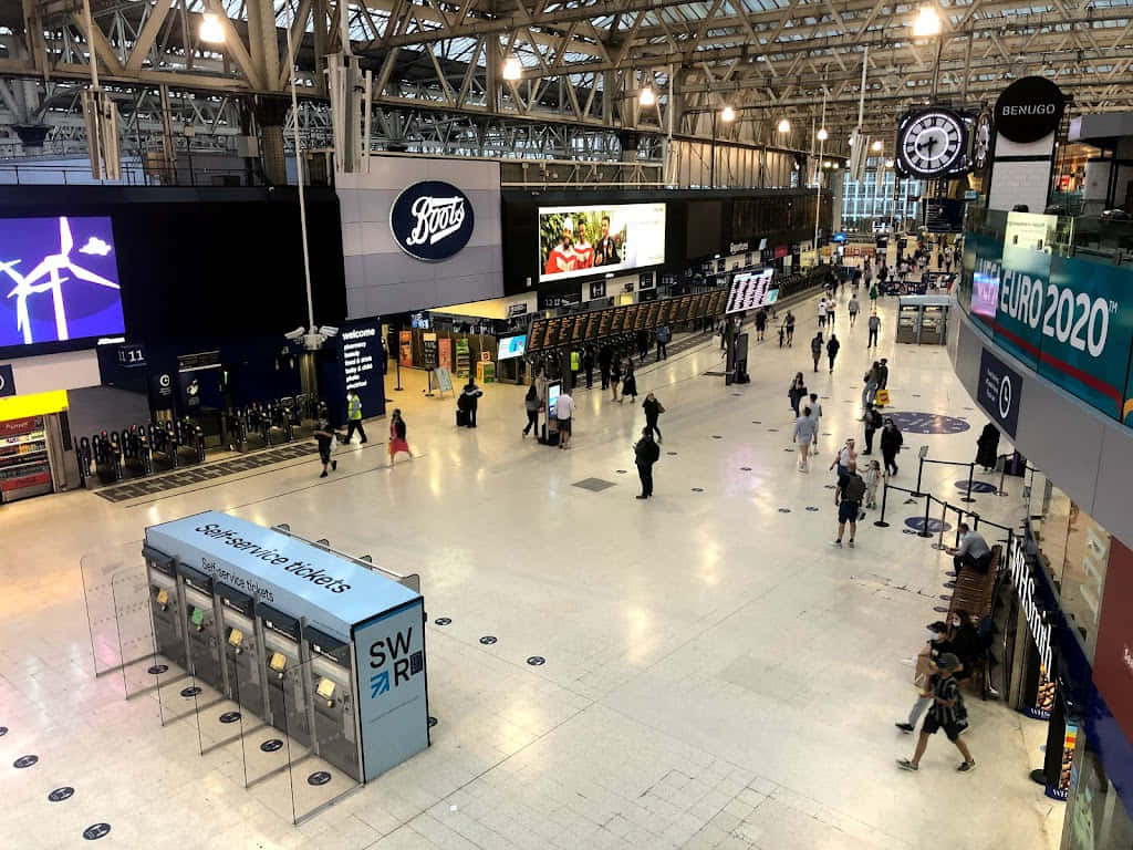 People Walking Around Waterloo Station Background
