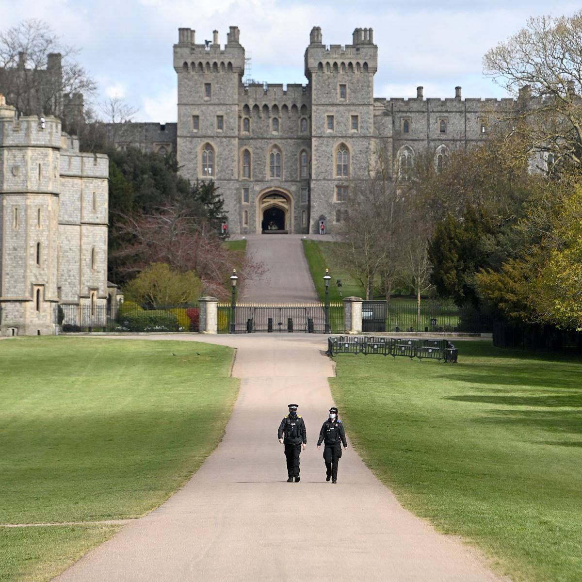 People Walking Down Windsor Castle Path Background