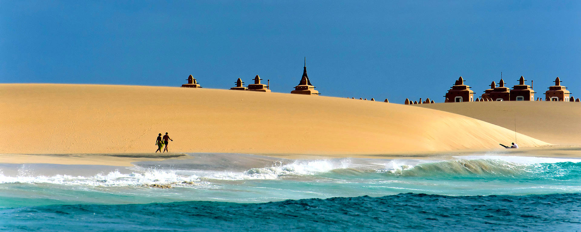 People Walking On Cape Verde Beach Background