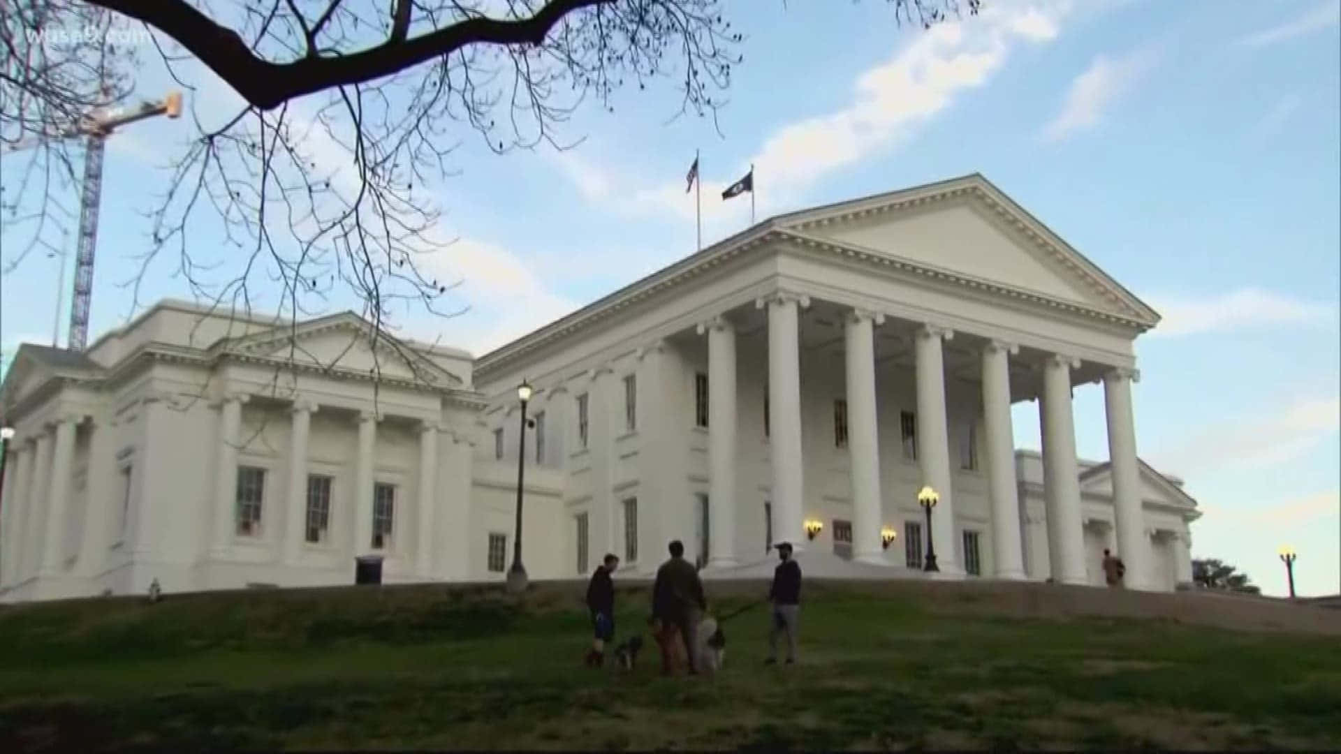People Walking Their Pets Outside The Virginia State Capitol Background
