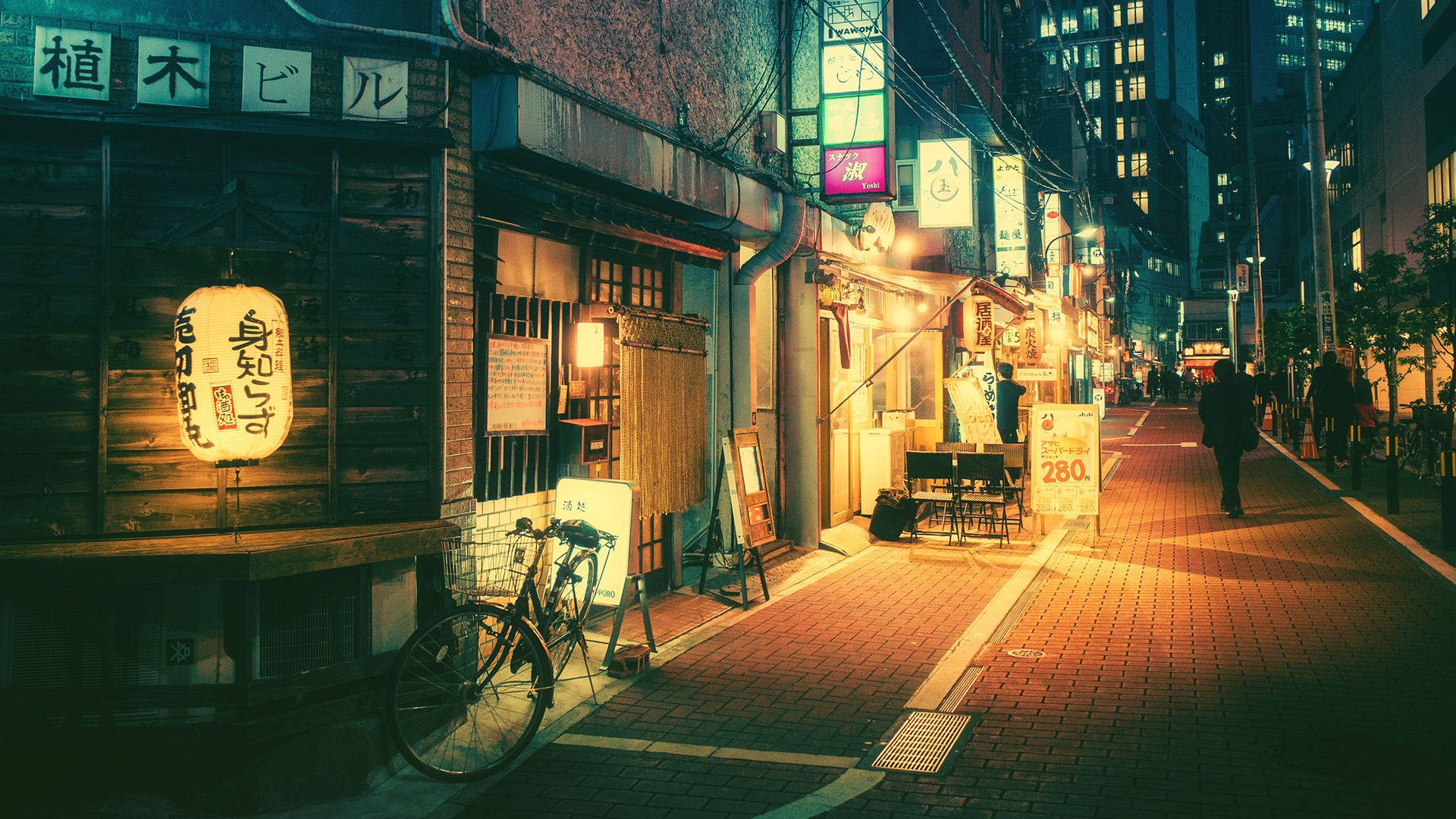 People Walking Through A Shopping District In Tokyo. Background