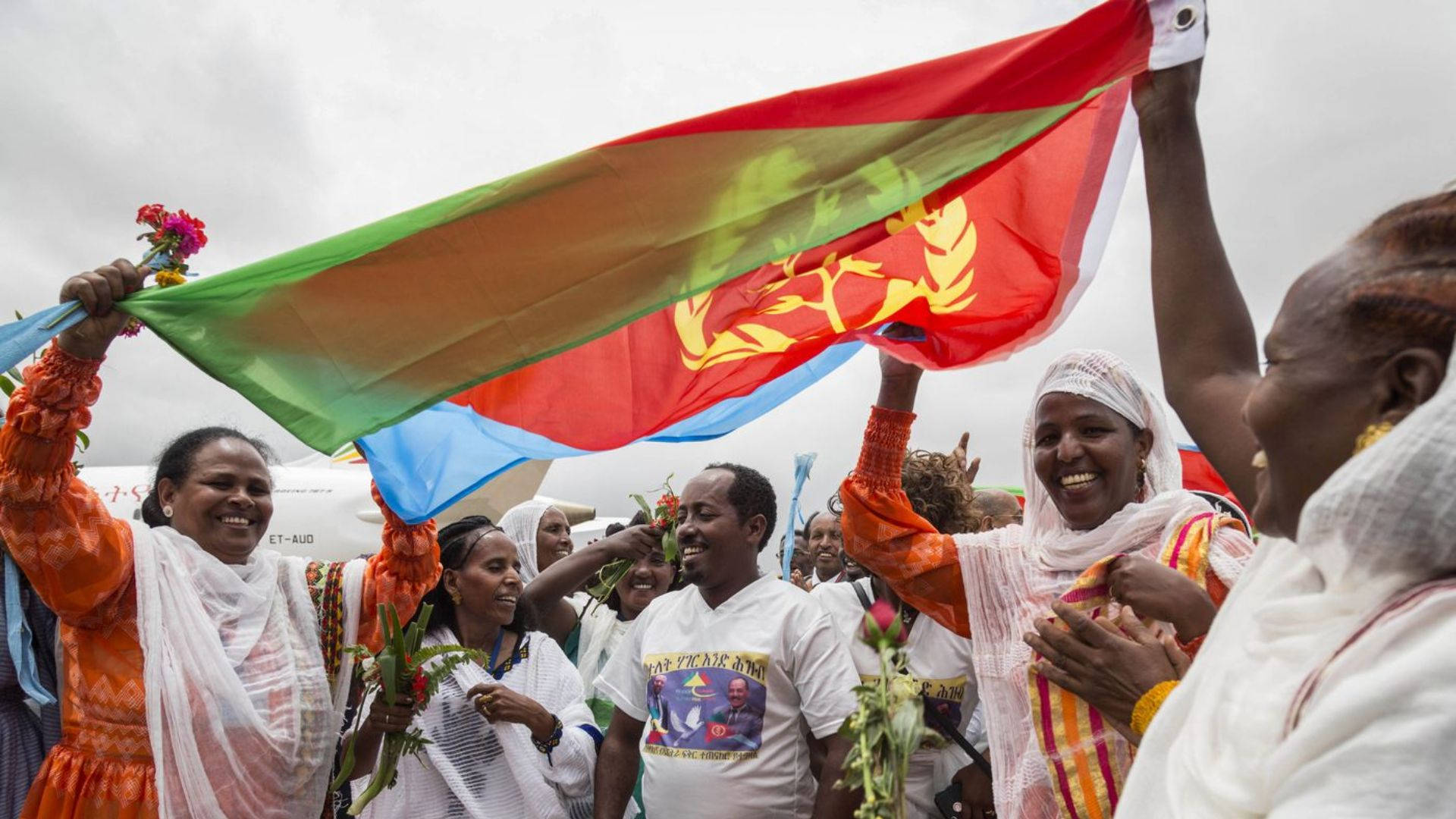 People Waving Eritrea Flag Background