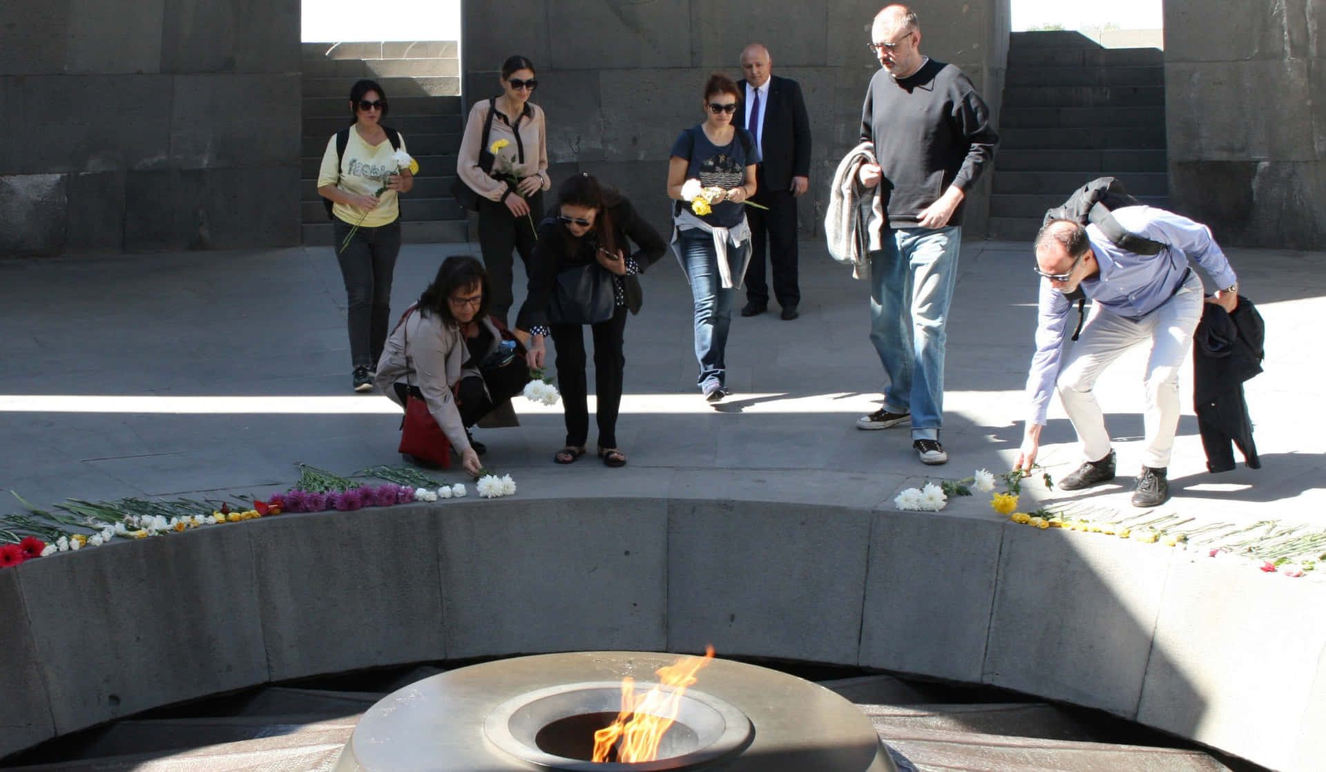 People With Flowers Armenian Genocide Memorial Background