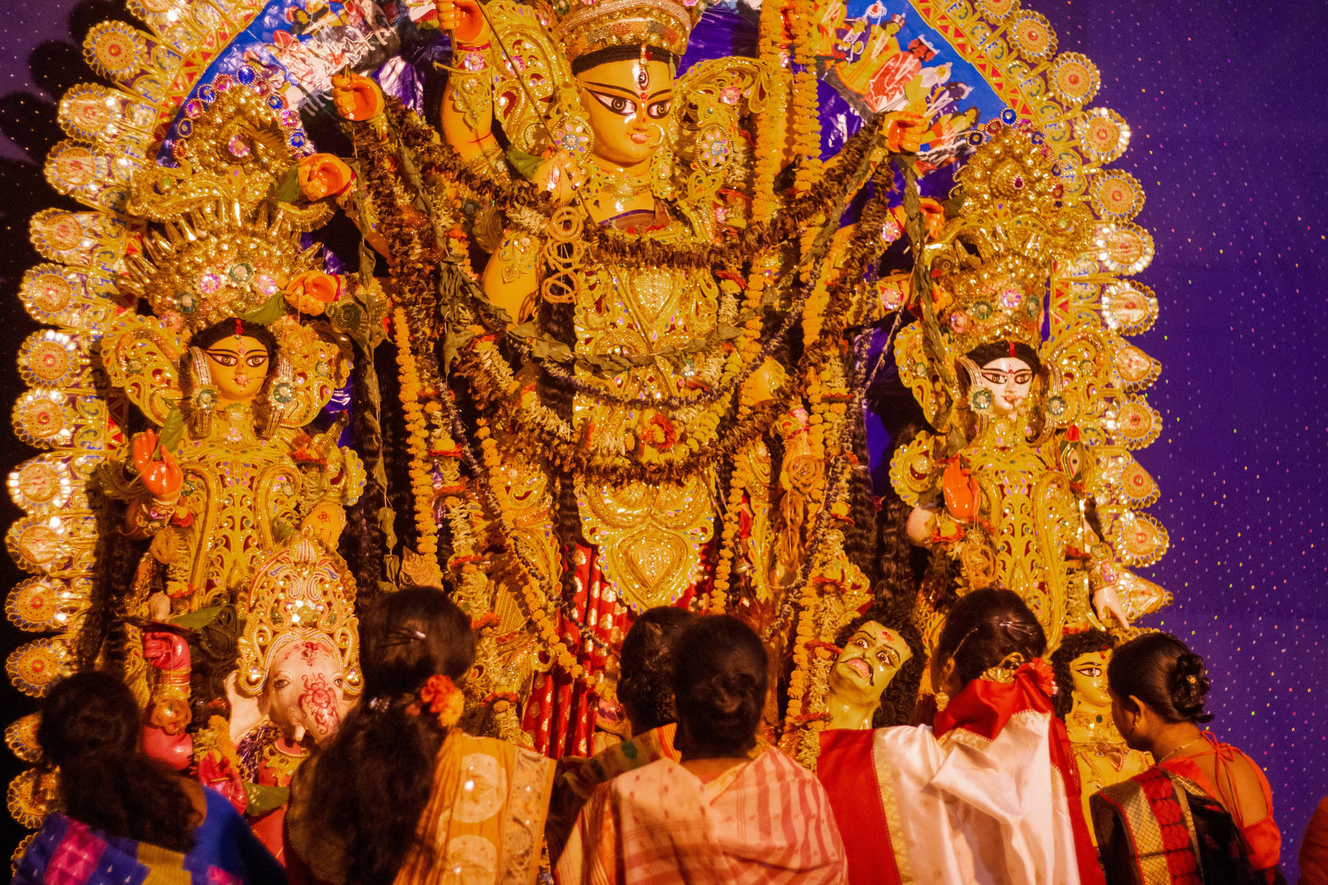 People Worshipping Deity Maa Durga Background