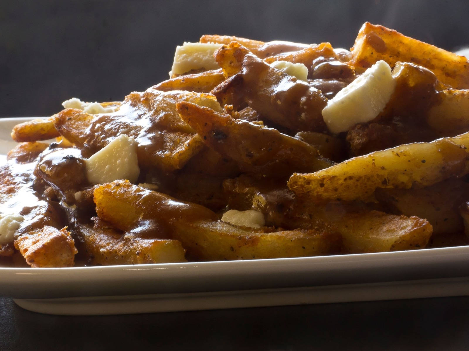 Perfectly Plated Canadian Poutine Dish Background