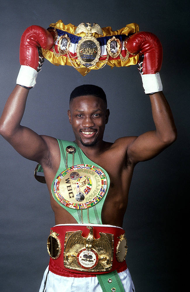 Pernell Whitaker With Three Belts Background