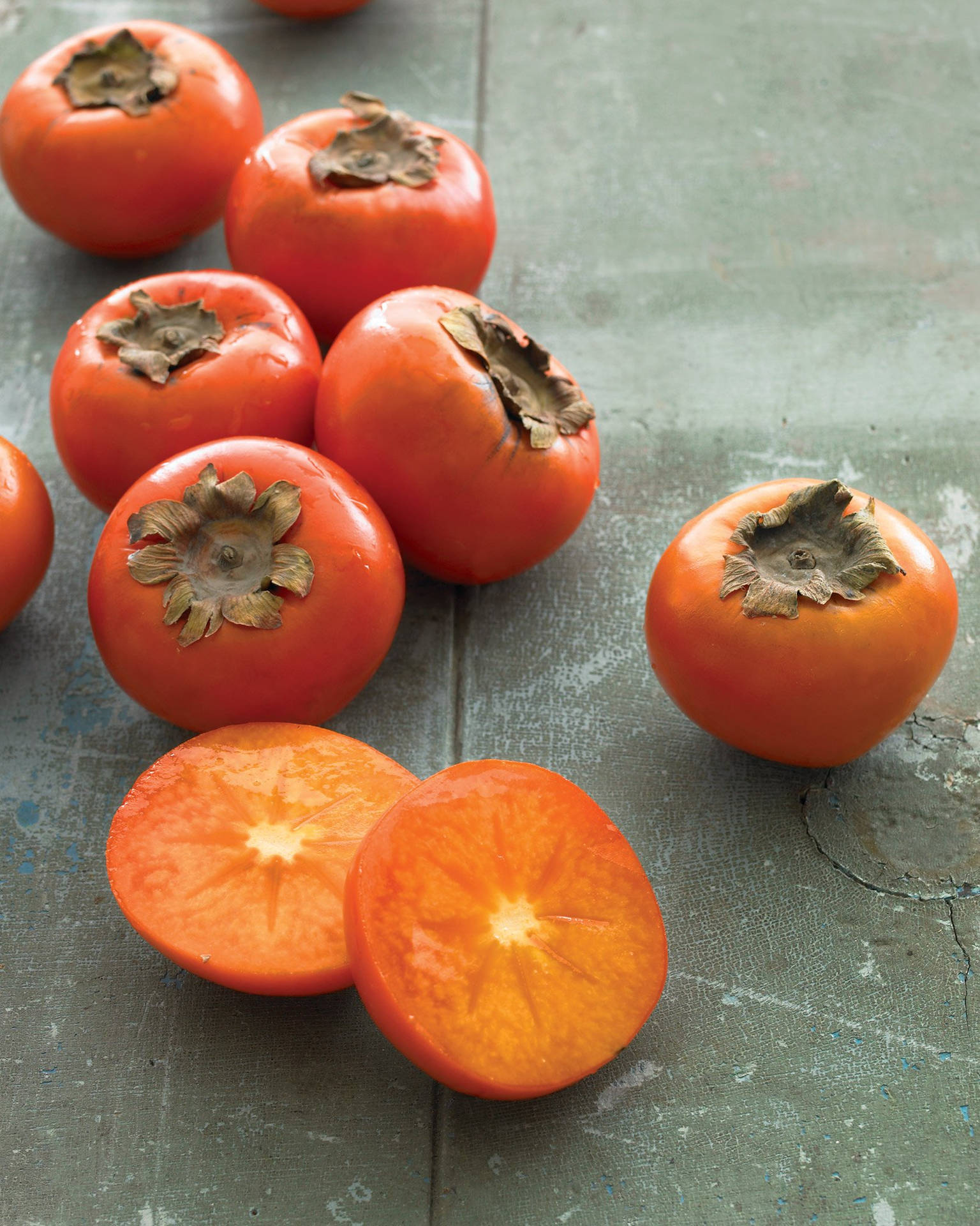 Persimmon Fruit On Table Background