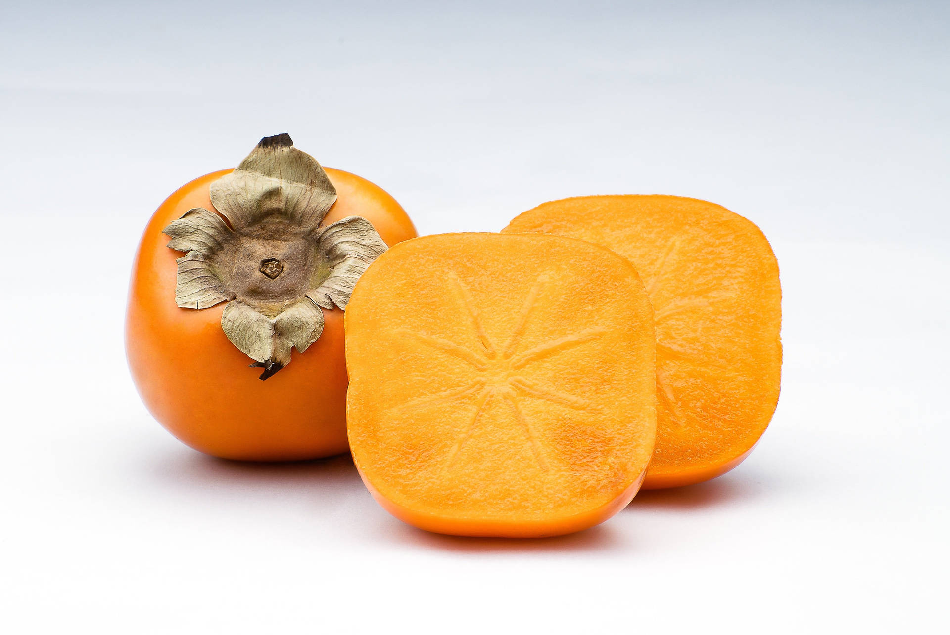 Persimmon Fruit On White Table Background