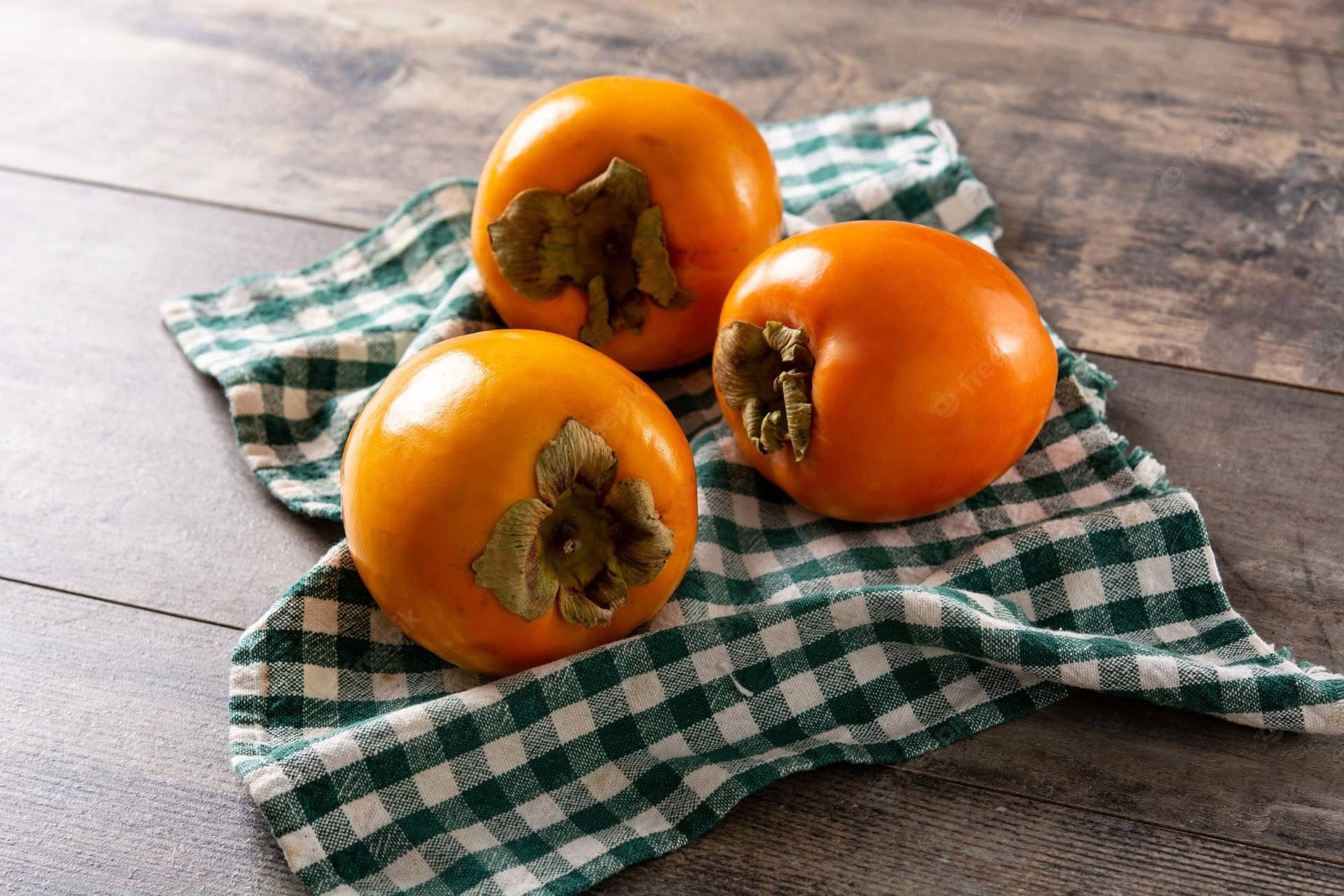 Persimmon Spread On Table Background