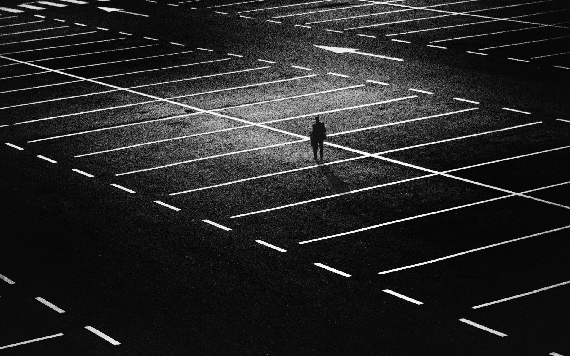 Person Alone In A Parking Lot